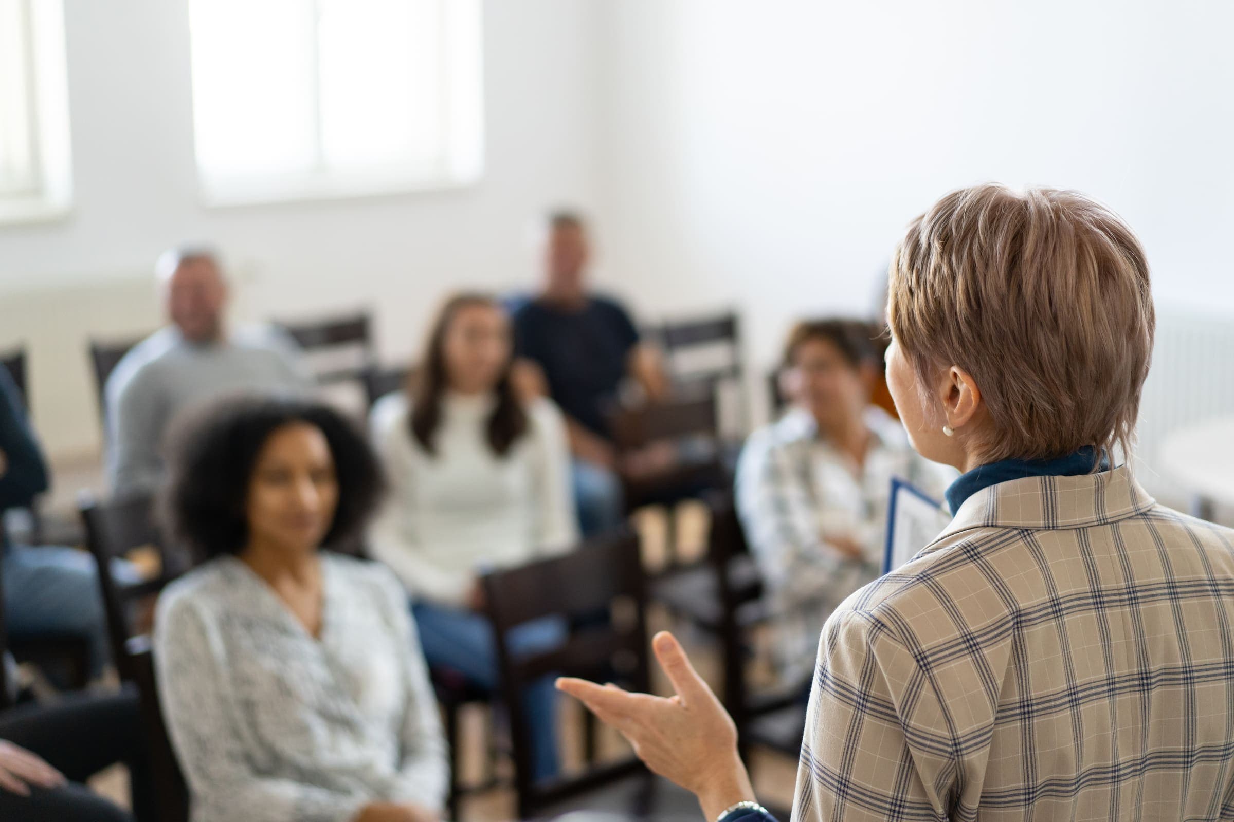 A facilitator leading a small group through a leadership session