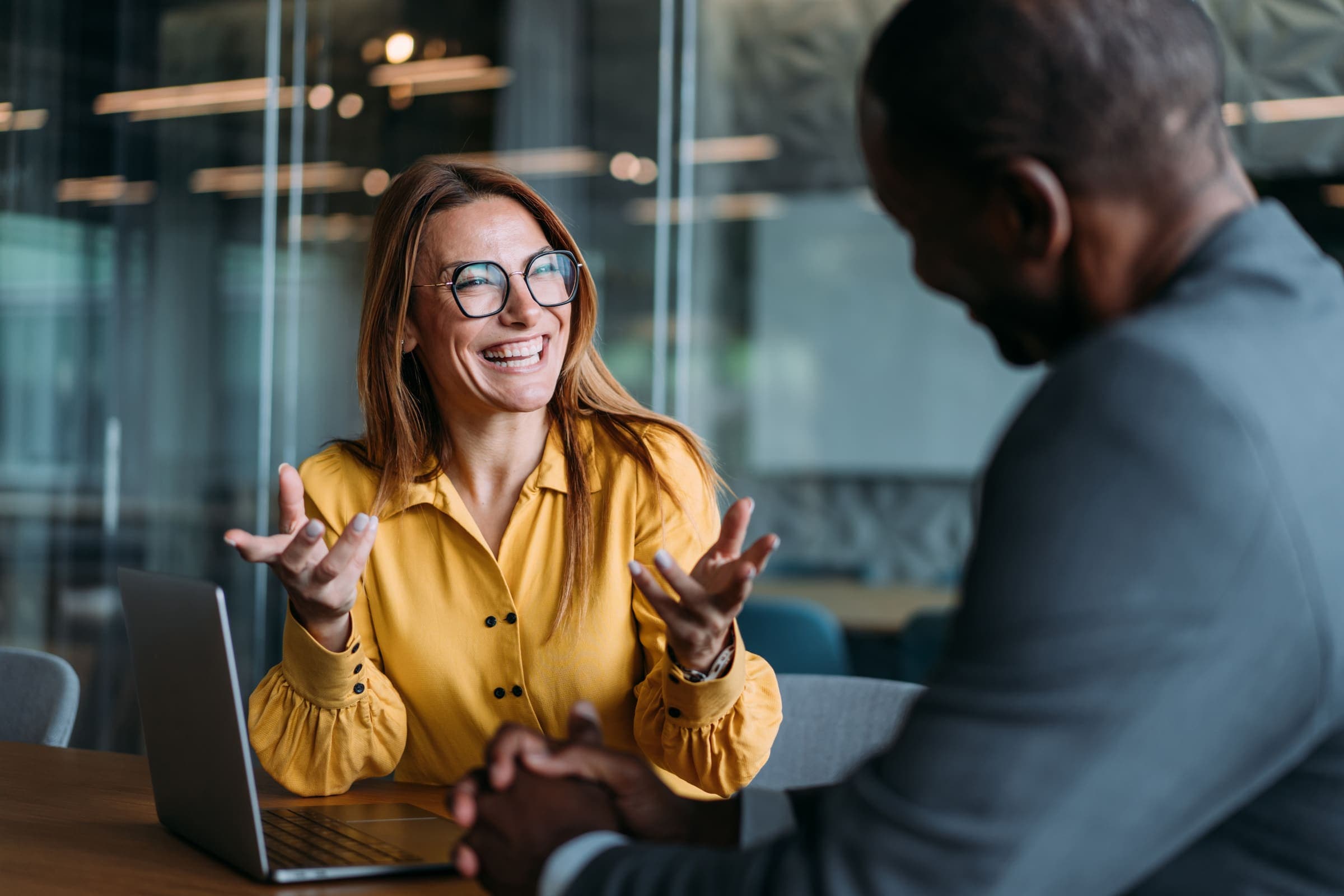Professional coaching conversation in a modern office
