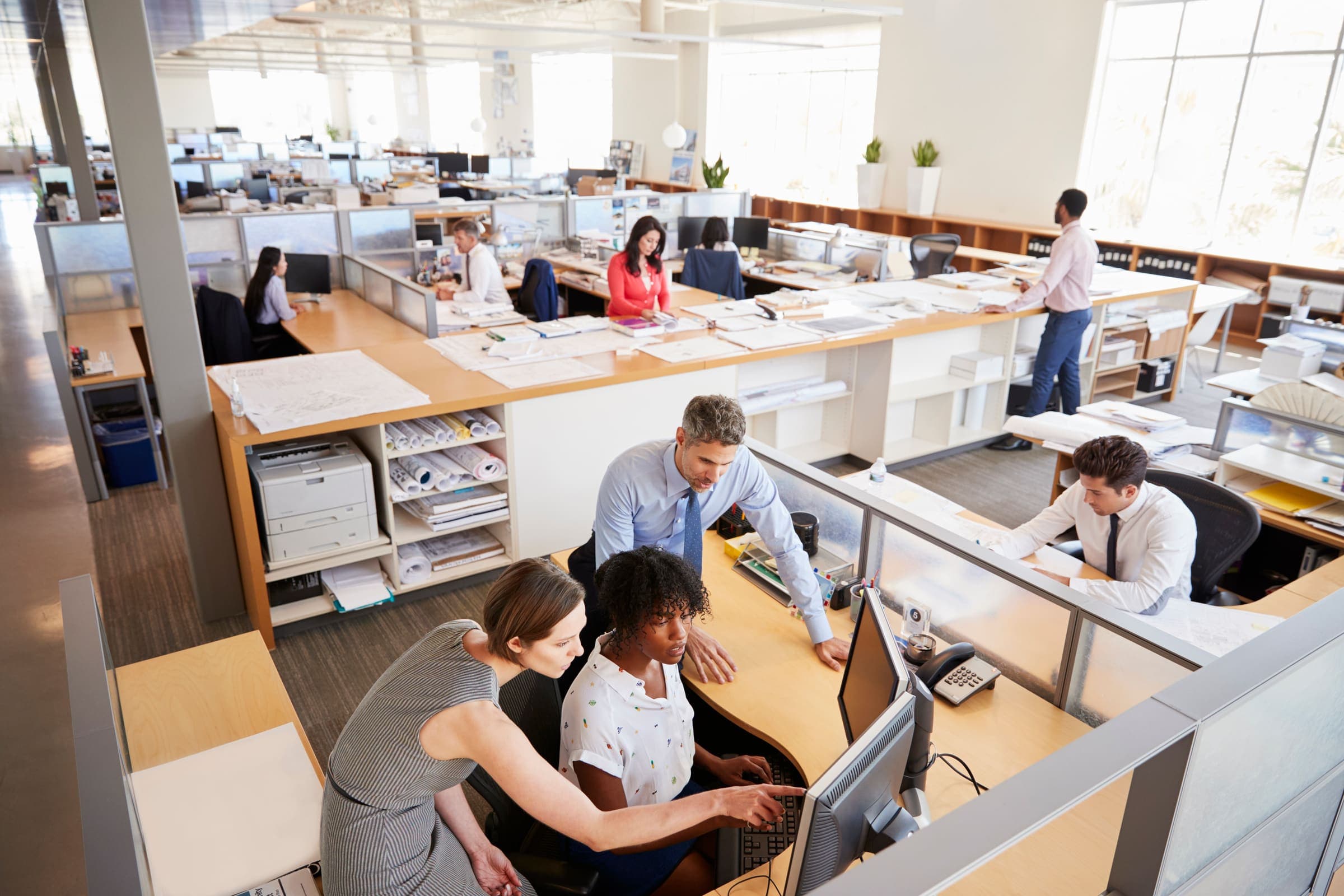 Team collaborating in an open office environment