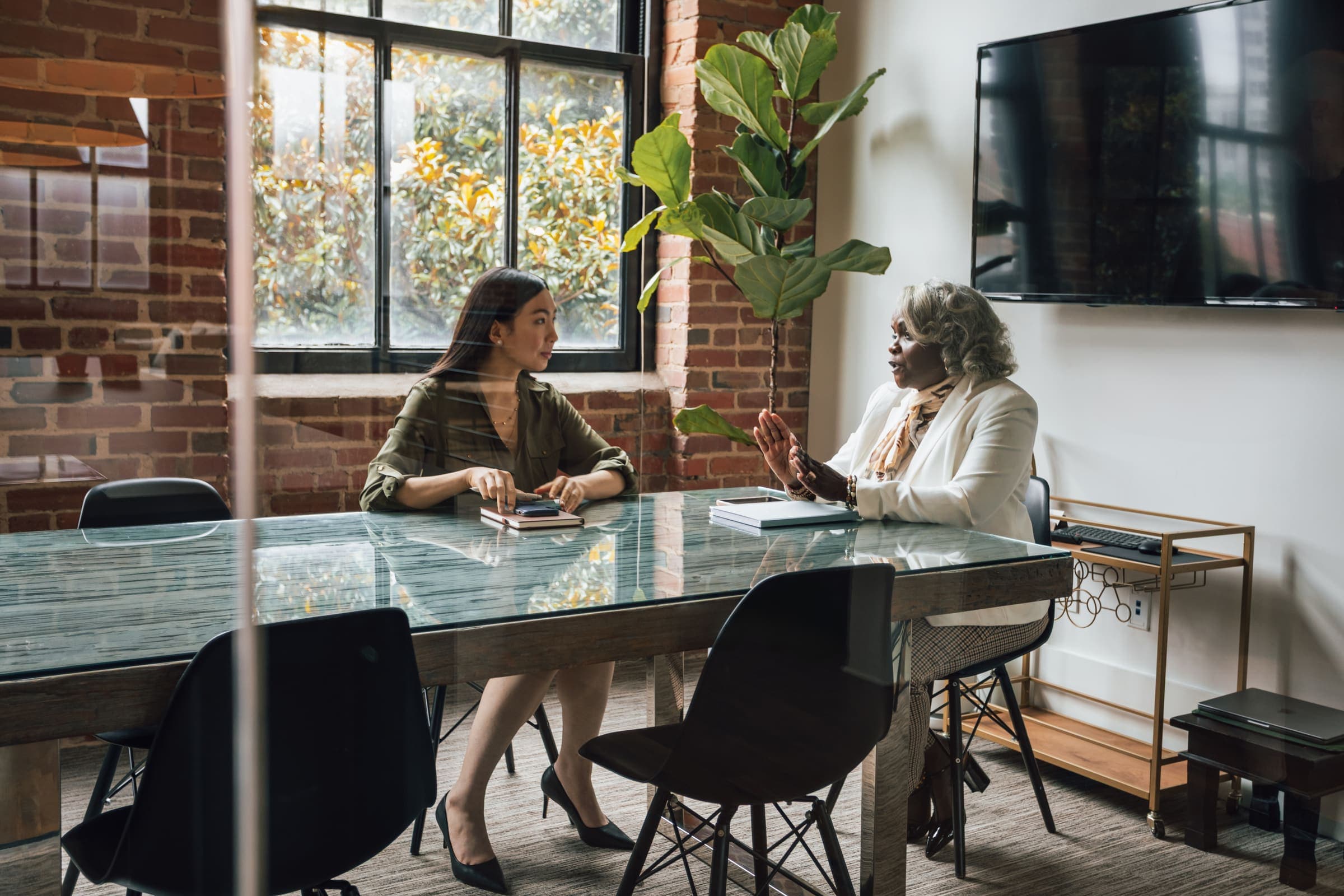 Two business leaders in a strategic conversation